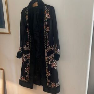 Black long jacket silk with fur trim on cuffs lapel and bottom 2 front pockets